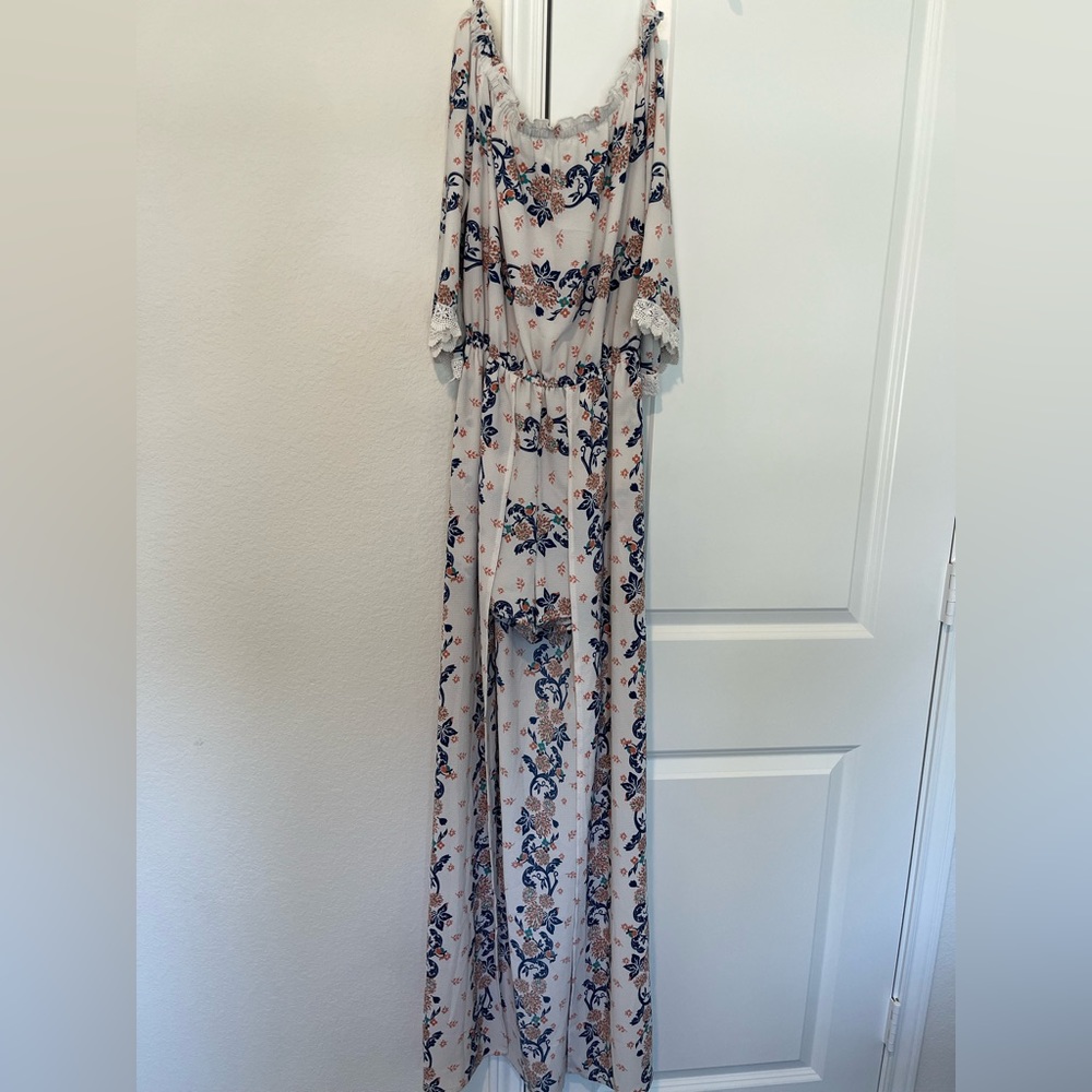 romper dress with shorts and long overlay. One piece outfit.